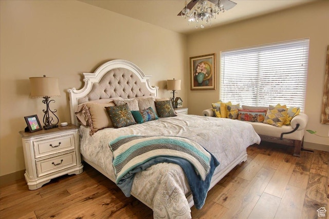 2630 E Riley Dr N, Eagle Mountain, UT 84005 - bedroom with a chandelier and hardwood / wood-style floors