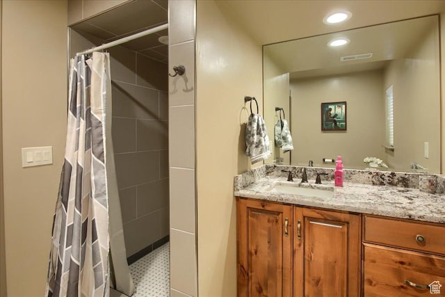 2630 E Riley Dr N, Eagle Mountain, UT 84005 - full bathroom with recessed lighting, a tile shower, tile patterned floors, visible vents, and vanity