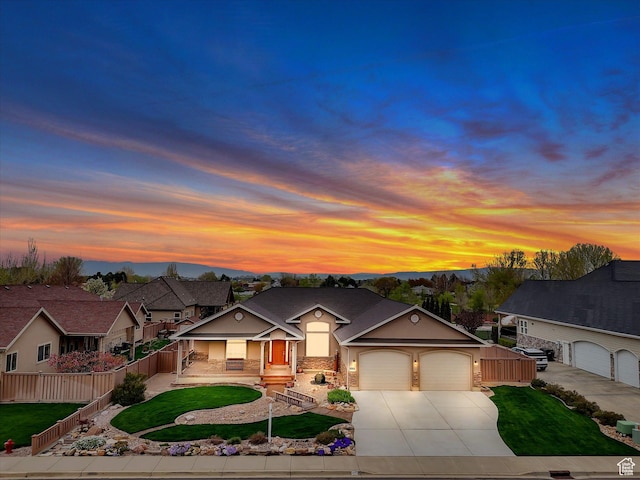 1055 N 1000 E, Mapleton, UT 84664 - traditional-style house featuring fence, concrete driveway, covered porch, a front yard, and a garage