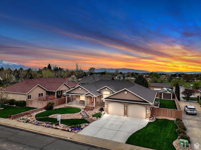 1055 N 1000 E, Mapleton, UT 84664 - view of front of property featuring covered porch, concrete driveway, fence, an attached garage, and a yard