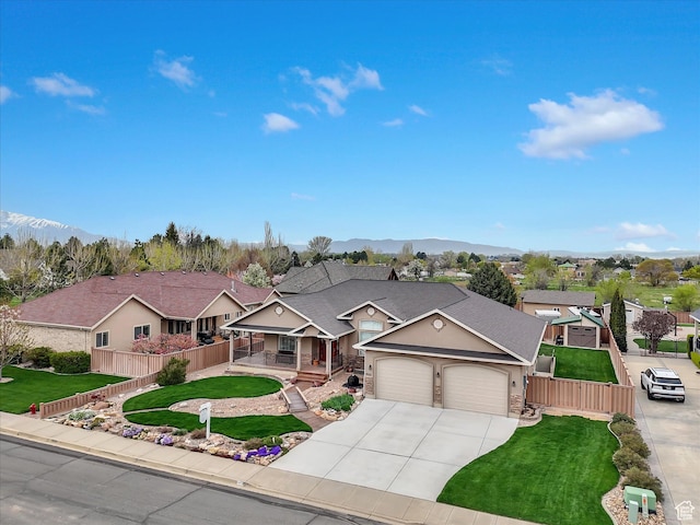 1055 N 1000 E, Mapleton, UT 84664 - single story home with concrete driveway, an attached garage, fence, and a porch