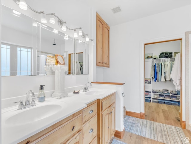 1055 N 1000 E, Mapleton, UT 84664 - bathroom with wood finished floors, a sink, visible vents, and double vanity
