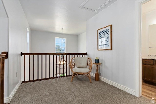 sitting room with light carpet and baseboards