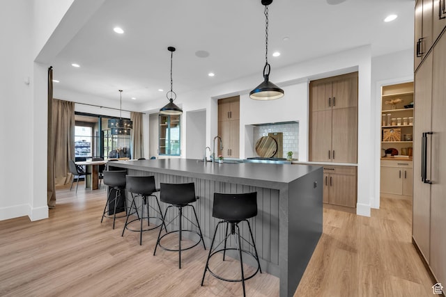 565 W Autumn Blaze, Woodland Hills, UT 84653 - kitchen featuring recessed lighting, light wood-style floors, a sink, and modern cabinets