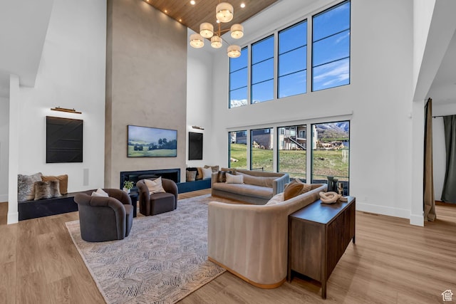 565 W Autumn Blaze, Woodland Hills, UT 84653 - living area with light wood-type flooring, baseboards, a high ceiling, and recessed lighting