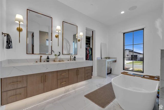565 W Autumn Blaze, Woodland Hills, UT 84653 - bathroom featuring a sink, a spacious closet, marble finish floor, double vanity, and a freestanding bath