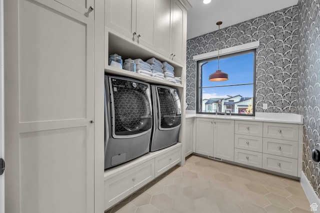565 W Autumn Blaze, Woodland Hills, UT 84653 - clothes washing area featuring washing machine and dryer, wallpapered walls, and cabinet space