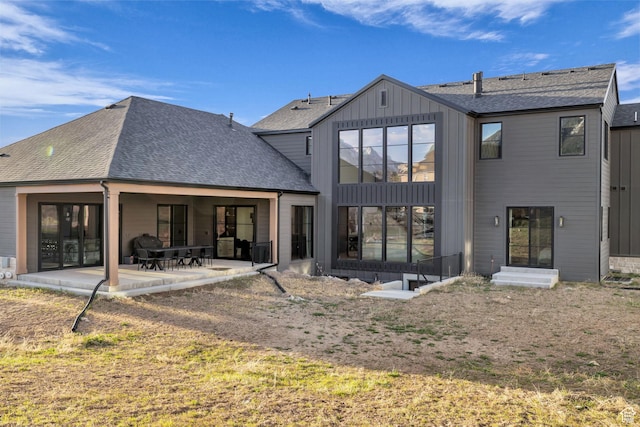 565 W Autumn Blaze, Woodland Hills, UT 84653 - back of property with roof with shingles, a patio area, and board and batten siding