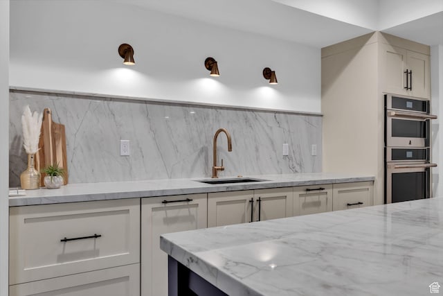 565 W Autumn Blaze, Woodland Hills, UT 84653 - kitchen featuring double oven, tasteful backsplash, white cabinetry, and a sink