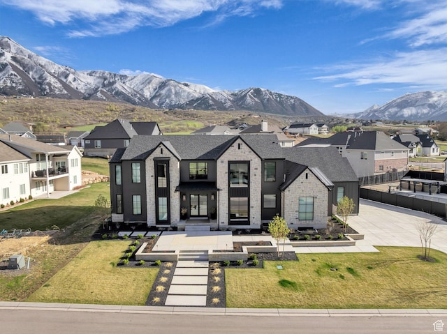 565 W Autumn Blaze, Woodland Hills, UT 84653 - view of front of house with a shingled roof, a front lawn, a residential view, brick siding, and a mountain view