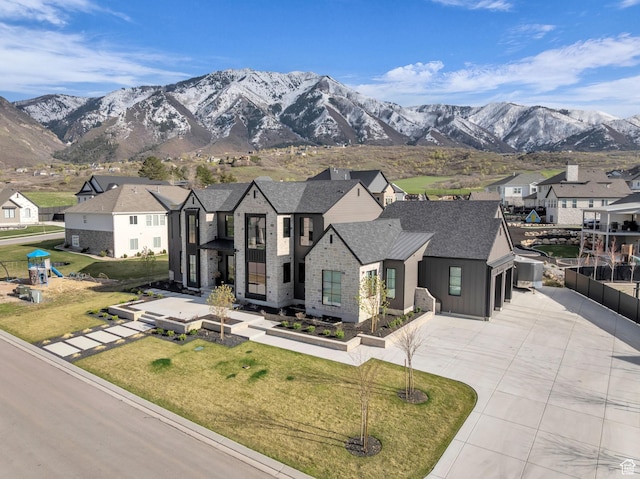 565 W Autumn Blaze, Woodland Hills, UT 84653 - view of front of home with a residential view, a mountain view, and curved driveway