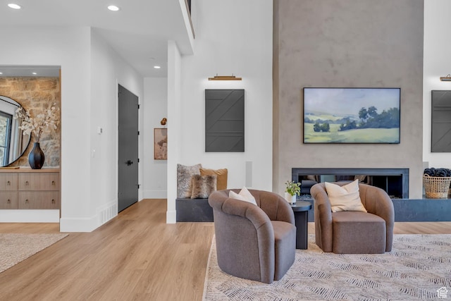 565 W Autumn Blaze, Woodland Hills, UT 84653 - living room featuring a fireplace, wood finished floors, baseboards, and recessed lighting