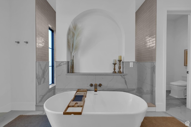 565 W Autumn Blaze, Woodland Hills, UT 84653 - bathroom with marble finish floor, toilet, and a freestanding bath