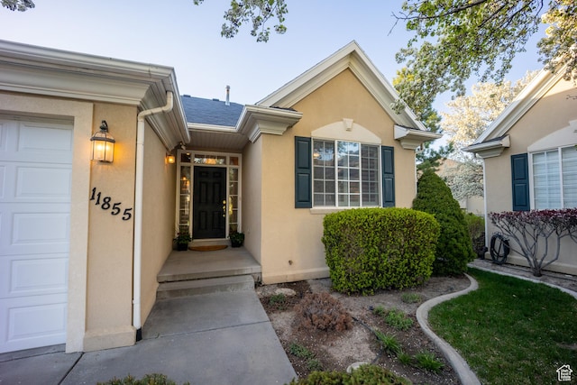 11855 S Cottage Side Way E, Draper, UT 84020 - doorway to property with a garage and stucco siding