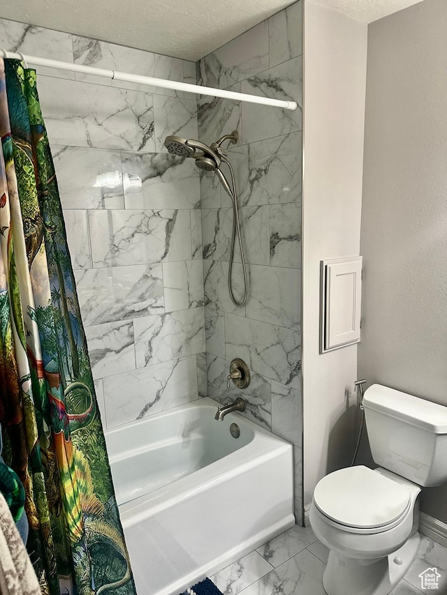 full bath with a textured ceiling, toilet, baseboards, shower / tub combo, and marble finish floor
