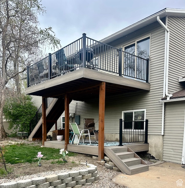 back of property with a wooden deck