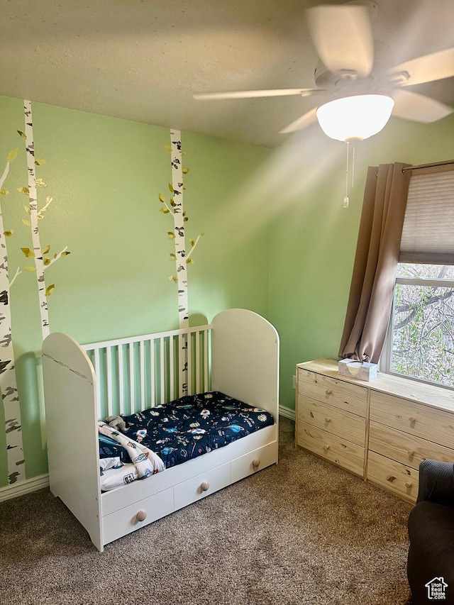 carpeted bedroom featuring ceiling fan