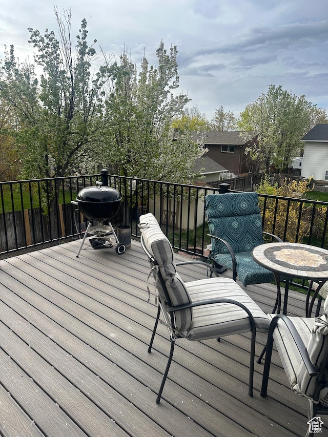 wooden deck featuring grilling area