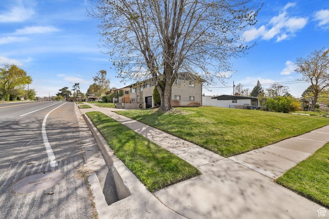 view of front of house with a front lawn and a residential view