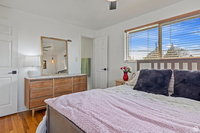 bedroom with wood finished floors and a ceiling fan
