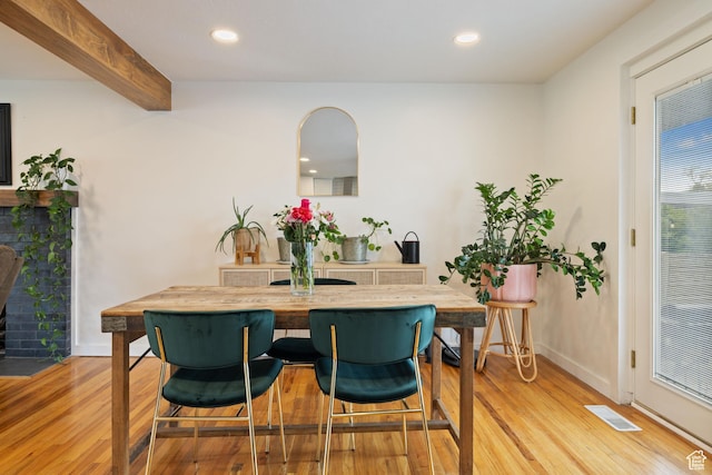 dining room featuring light wood-style flooring, visible vents, and recessed lighting
