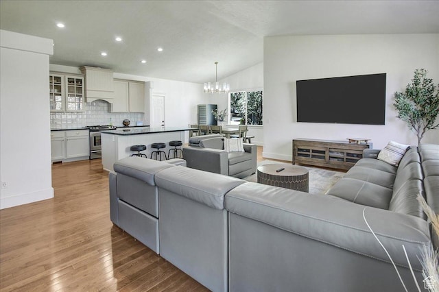 857 E Park School Rd, Draper, UT 84020 - living area featuring recessed lighting, lofted ceiling, wood finished floors, baseboards, and a notable chandelier
