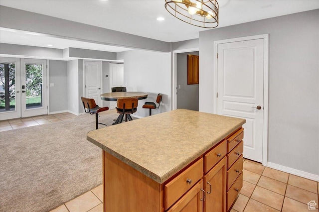 857 E Park School Rd, Draper, UT 84020 - kitchen featuring recessed lighting, light tile patterned floors, a kitchen island, baseboards, and brown cabinetry