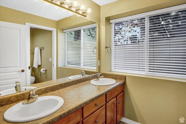 857 E Park School Rd, Draper, UT 84020 - bathroom featuring double vanity, toilet, and a sink