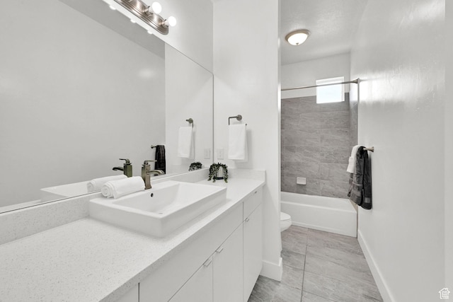 3586 S Zinc Way, West Valley City, UT 84119 - bathroom featuring vanity, toilet, shower / washtub combination, and baseboards