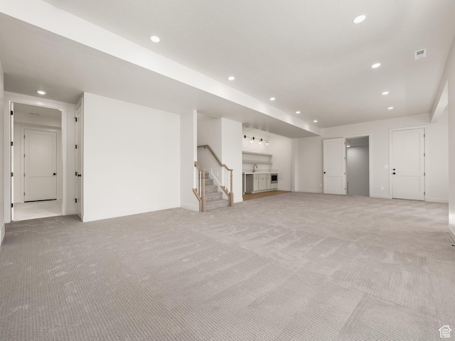 1554 S 920 E, Salem, UT 84653 - unfurnished living room featuring baseboards, recessed lighting, and light colored carpet