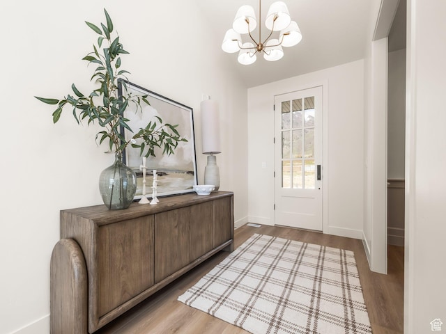 1554 S 920 E, Salem, UT 84653 - doorway to outside featuring wood finished floors, baseboards, and a notable chandelier