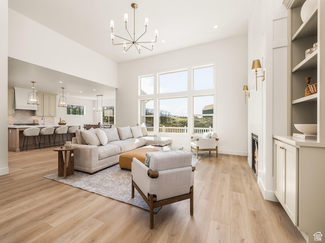 1554 S 920 E, Salem, UT 84653 - living area with an inviting chandelier, a healthy amount of sunlight, light wood-style floors, and recessed lighting