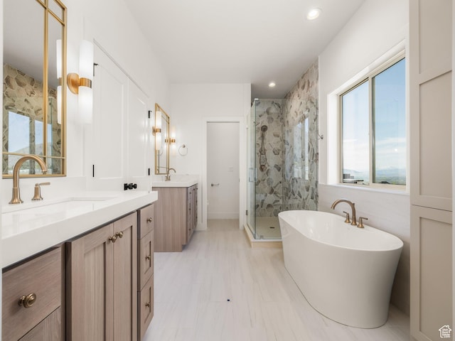 1554 S 920 E, Salem, UT 84653 - bathroom featuring two vanities, a freestanding tub, a stall shower, and a sink