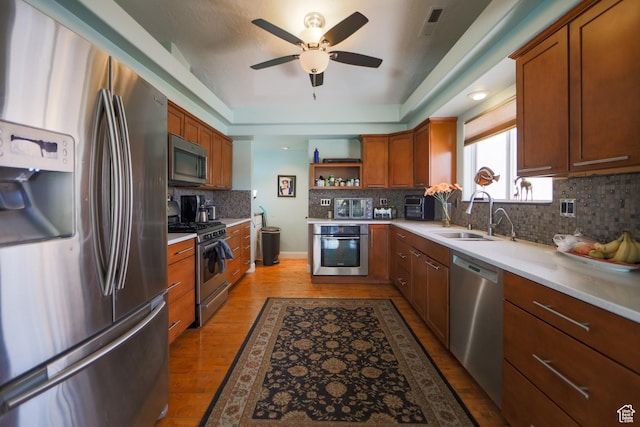 2201 S San Carlos Ct, Bloomington, UT 84790 - kitchen featuring open shelves, a sink, decorative backsplash, ceiling fan, and appliances with stainless steel finishes