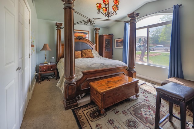 2201 S San Carlos Ct, Bloomington, UT 84790 - carpeted bedroom featuring vaulted ceiling and ornate columns