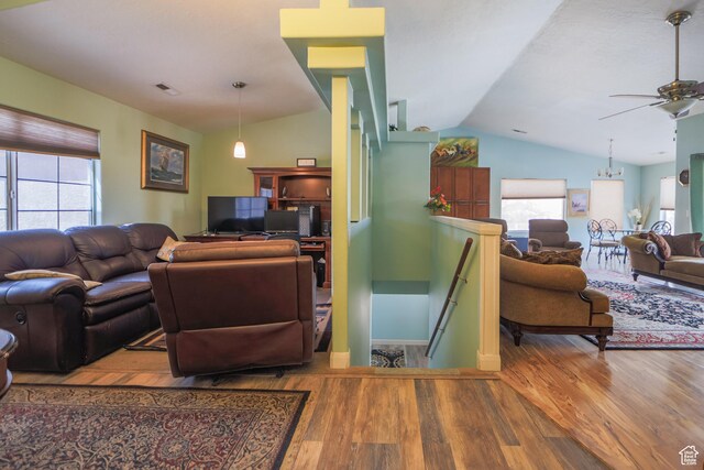 2201 S San Carlos Ct, Bloomington, UT 84790 - living area featuring vaulted ceiling, a ceiling fan, wood finished floors, and visible vents