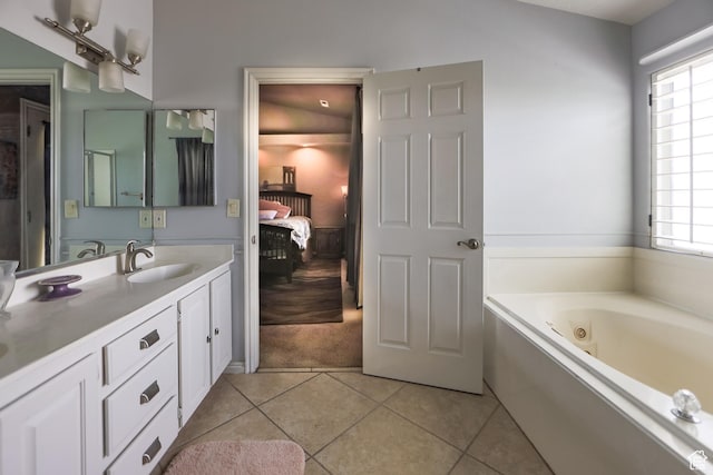 2201 S San Carlos Ct, Bloomington, UT 84790 - ensuite bathroom with a wealth of natural light, vanity, tile patterned floors, and a whirlpool tub