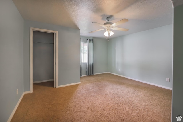 2201 S San Carlos Ct, Bloomington, UT 84790 - unfurnished bedroom with a closet, a textured ceiling, carpet flooring, and baseboards