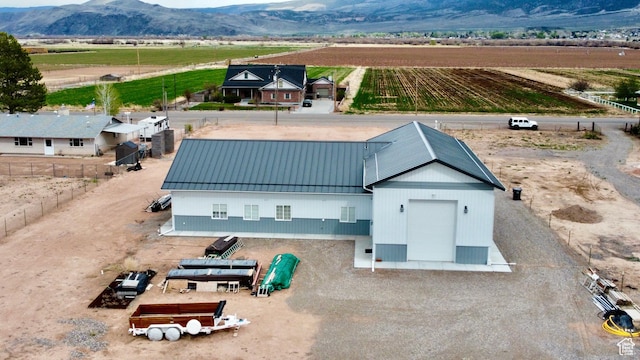 drone / aerial view with a rural view and a mountain view