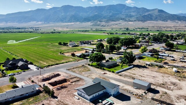 birds eye view of property featuring a rural view and a mountain view