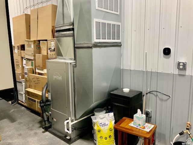 utility room with heating unit