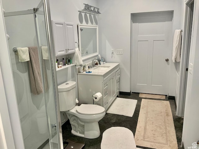bathroom featuring a shower stall, toilet, and vanity