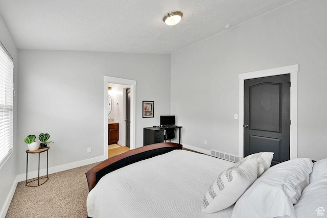3708 S Luchars Ln W, Salt Lake City, UT 84115 - carpeted bedroom with a textured ceiling, baseboards, visible vents, lofted ceiling, and connected bathroom