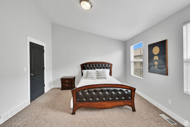 3708 S Luchars Ln W, Salt Lake City, UT 84115 - carpeted bedroom featuring lofted ceiling, baseboards, and visible vents