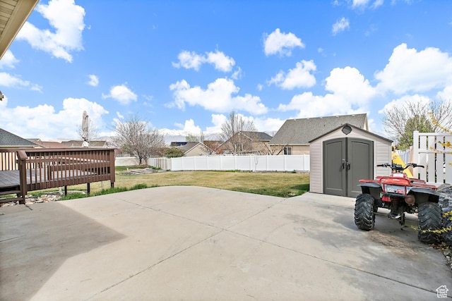 1354 S Star Cir W, Saratoga Springs, UT 84045 - view of patio featuring a residential view, a fenced backyard, a wooden deck, an outdoor structure, and a shed