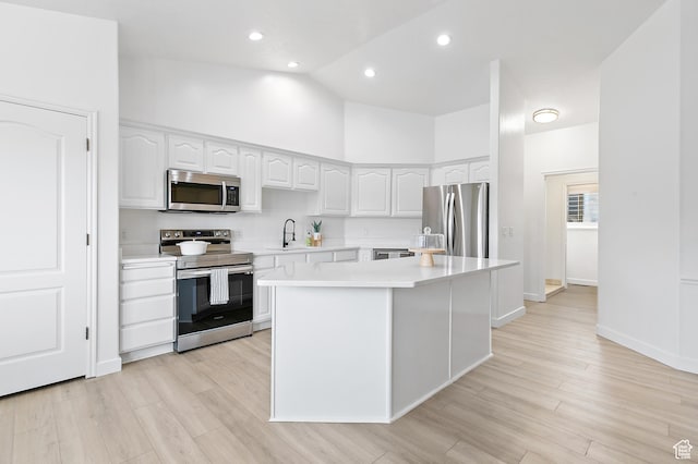 1354 S Star Cir W, Saratoga Springs, UT 84045 - kitchen featuring light countertops, high vaulted ceiling, white cabinetry, and appliances with stainless steel finishes