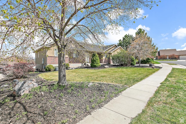 1354 S Star Cir W, Saratoga Springs, UT 84045 - view of front of home with brick siding and a front yard