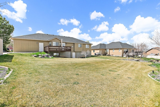 1354 S Star Cir W, Saratoga Springs, UT 84045 - rear view of property featuring a lawn, stucco siding, and a deck