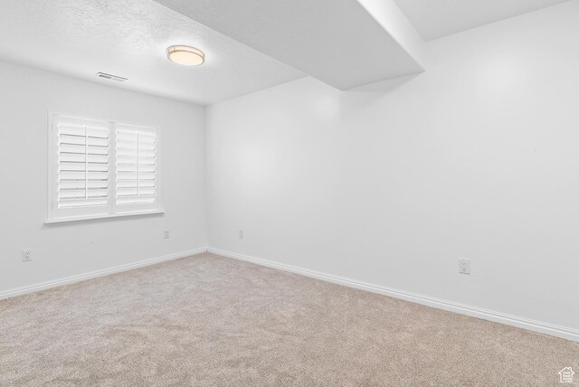 1354 S Star Cir W, Saratoga Springs, UT 84045 - carpeted empty room with baseboards, visible vents, and a textured ceiling