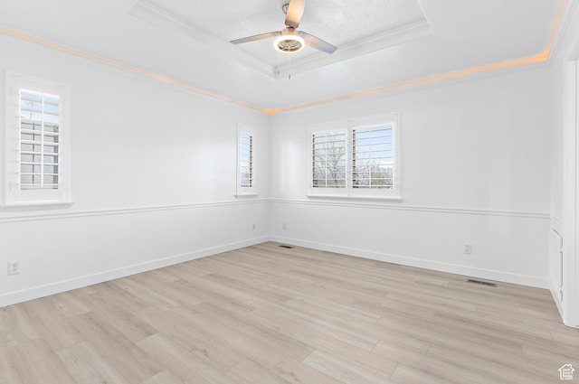 1354 S Star Cir W, Saratoga Springs, UT 84045 - spare room with crown molding, a tray ceiling, visible vents, and light wood-type flooring